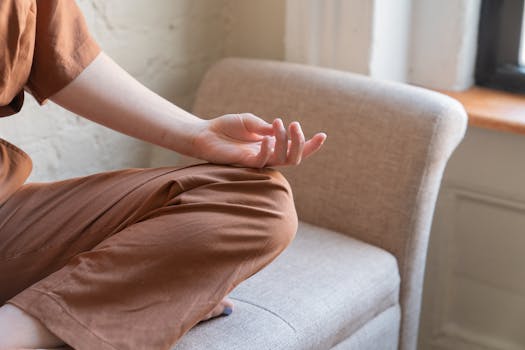 student meditating at home