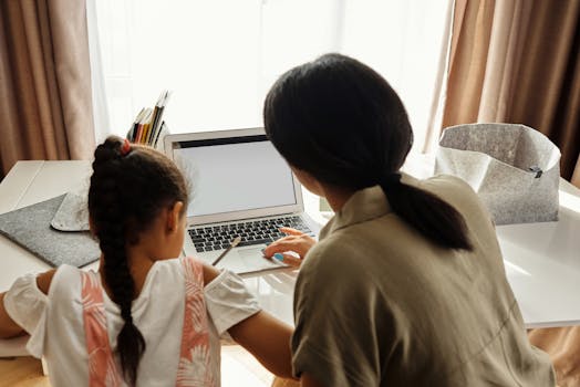 child studying on a laptop