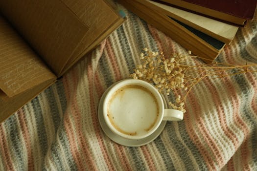 Stack of books with a cup of coffee