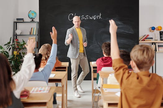 child raising hand in class