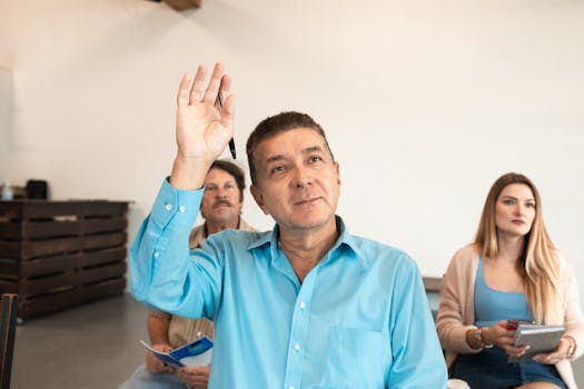 A teacher guiding students through a study workshop